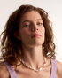 Soft and timeless pearl necklace styling