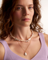 Delicate freshwater pearl necklace on model
