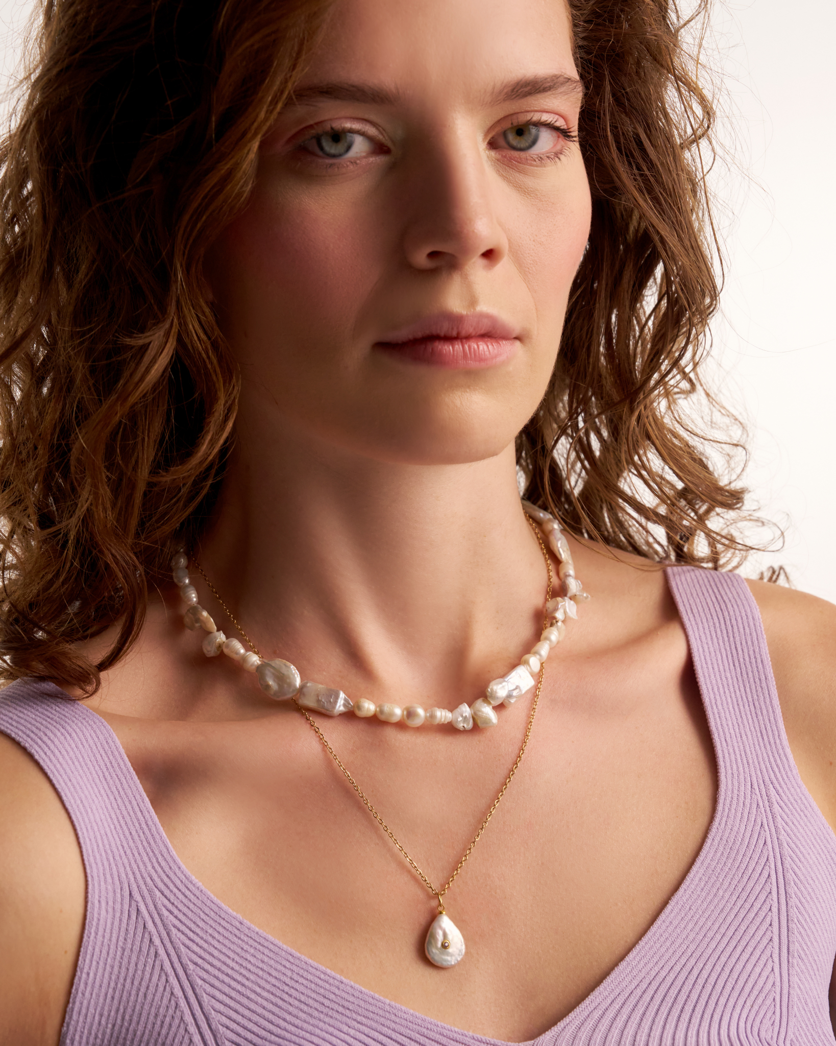 Minimal pearl necklace styled on model