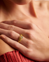 Woman wearing gold pavé stardust ring
