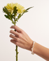 Woman wearing delicate pearl bracelet
