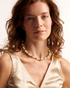 Minimal green pearl necklace on model