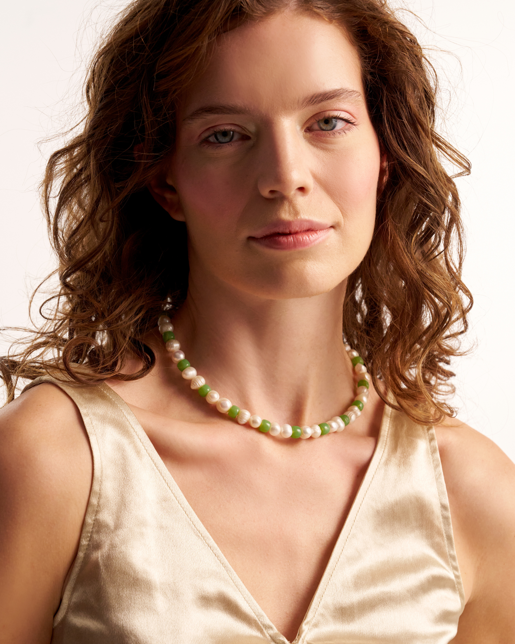 Minimal green pearl necklace on model