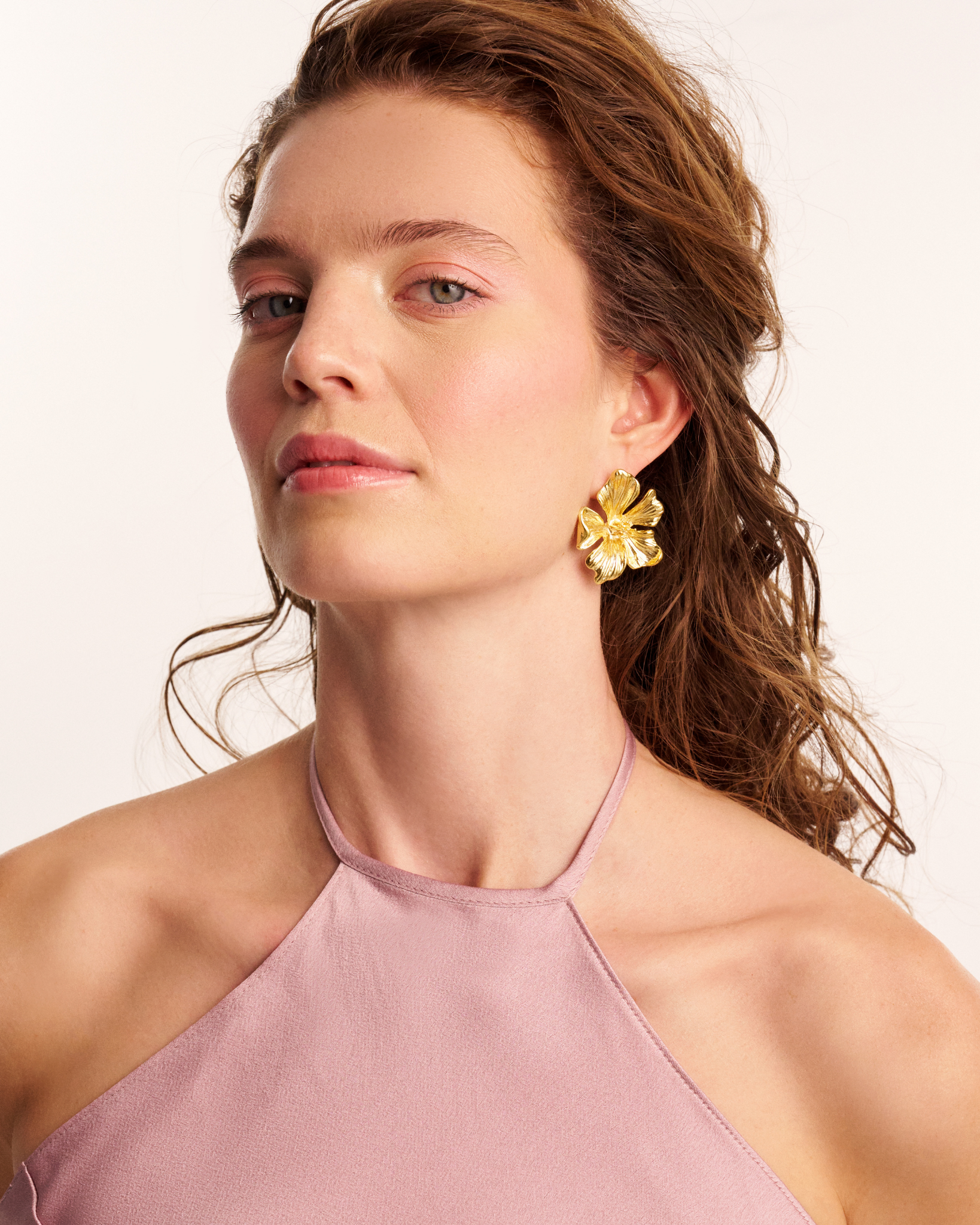 Handcrafted floral earrings on model