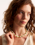 Close-up of handmade green pearl necklace
