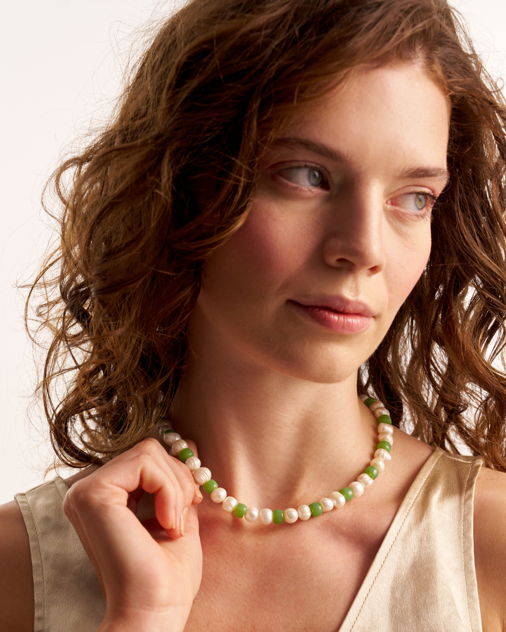 Close-up of handmade green pearl necklace