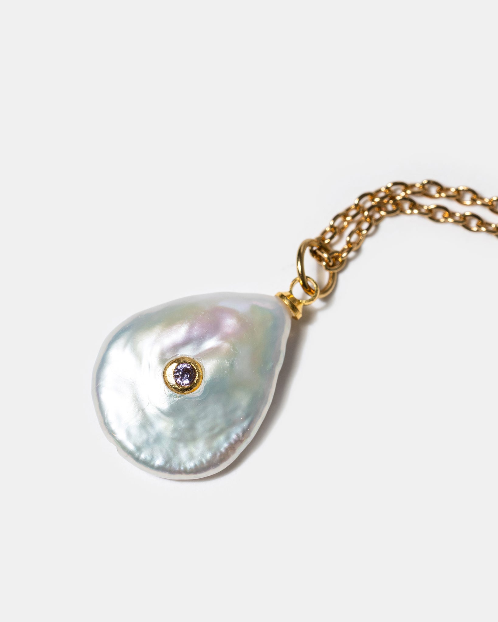 Close-up of baroque pearl pendant necklace