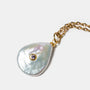 Close-up of baroque pearl pendant necklace