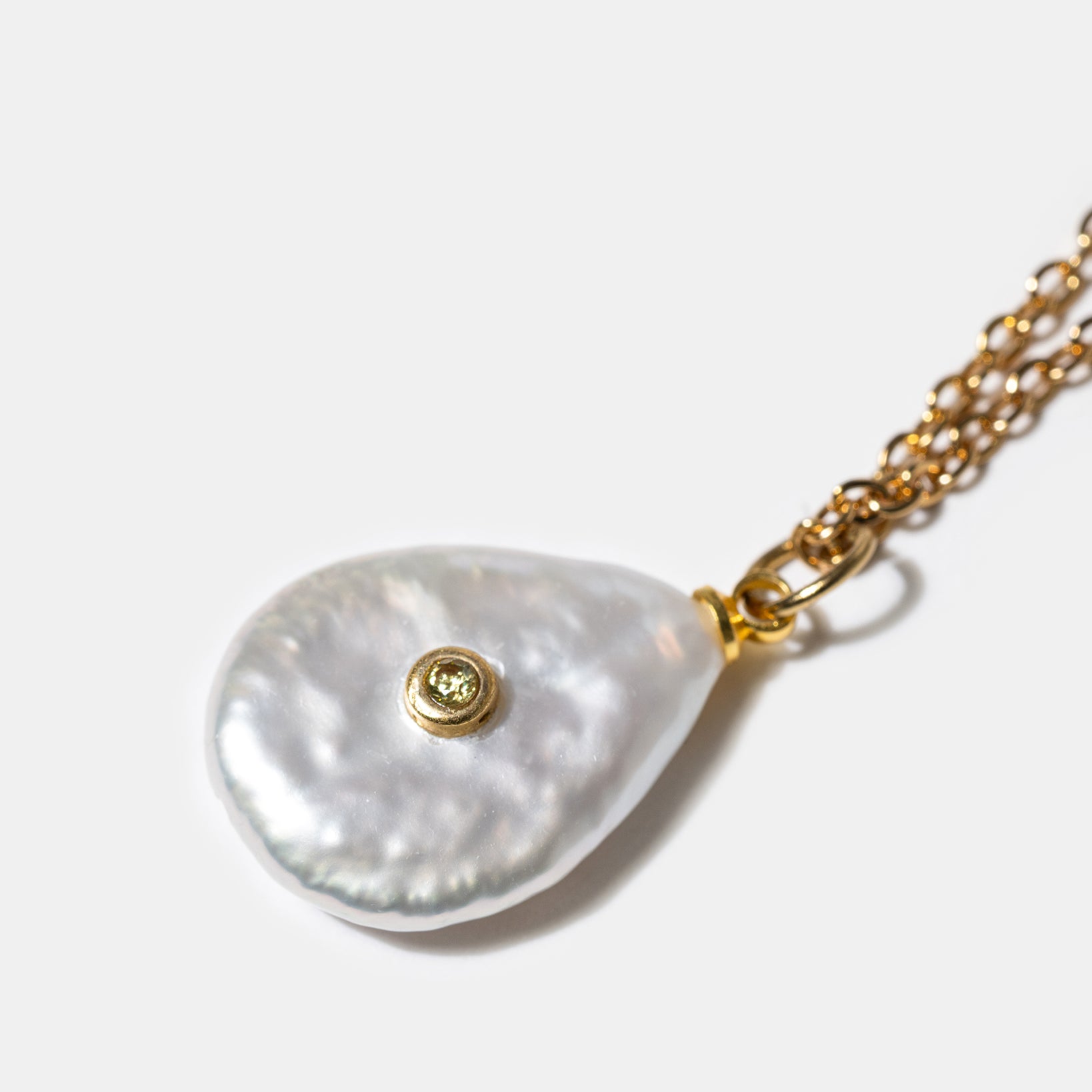Close-up of pearl pendant necklace