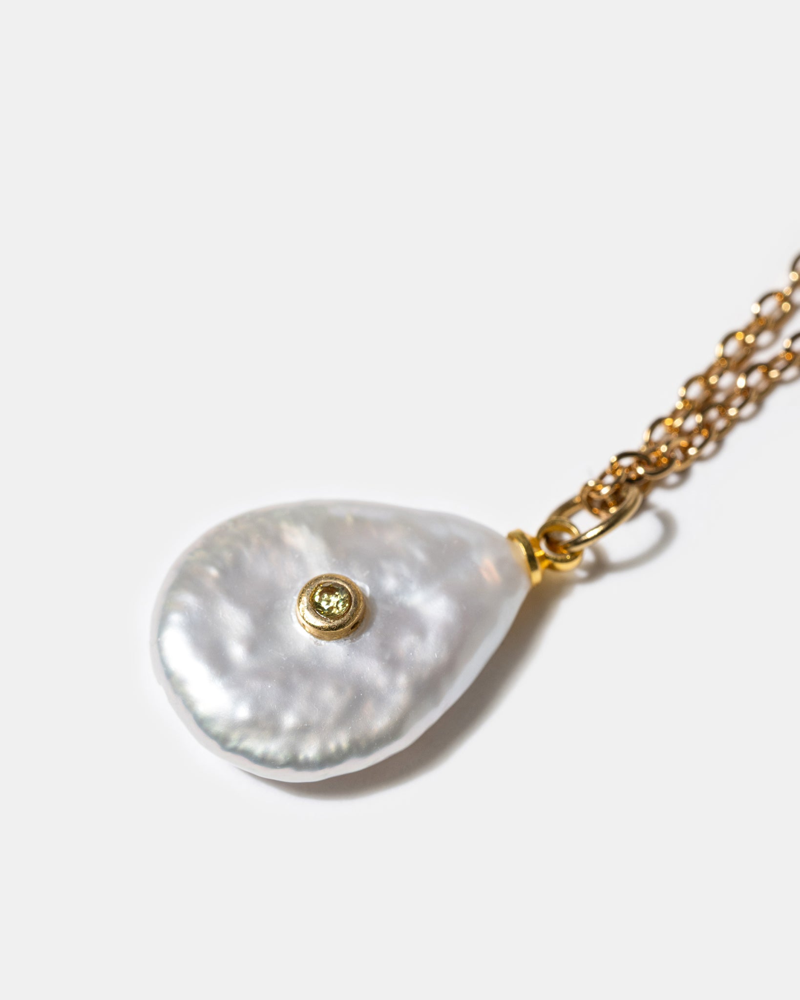 Close-up of pearl pendant necklace