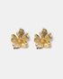 Textured flower stud earrings close-up