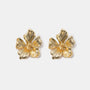 Textured flower stud earrings close-up