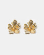 Textured flower stud earrings close-up