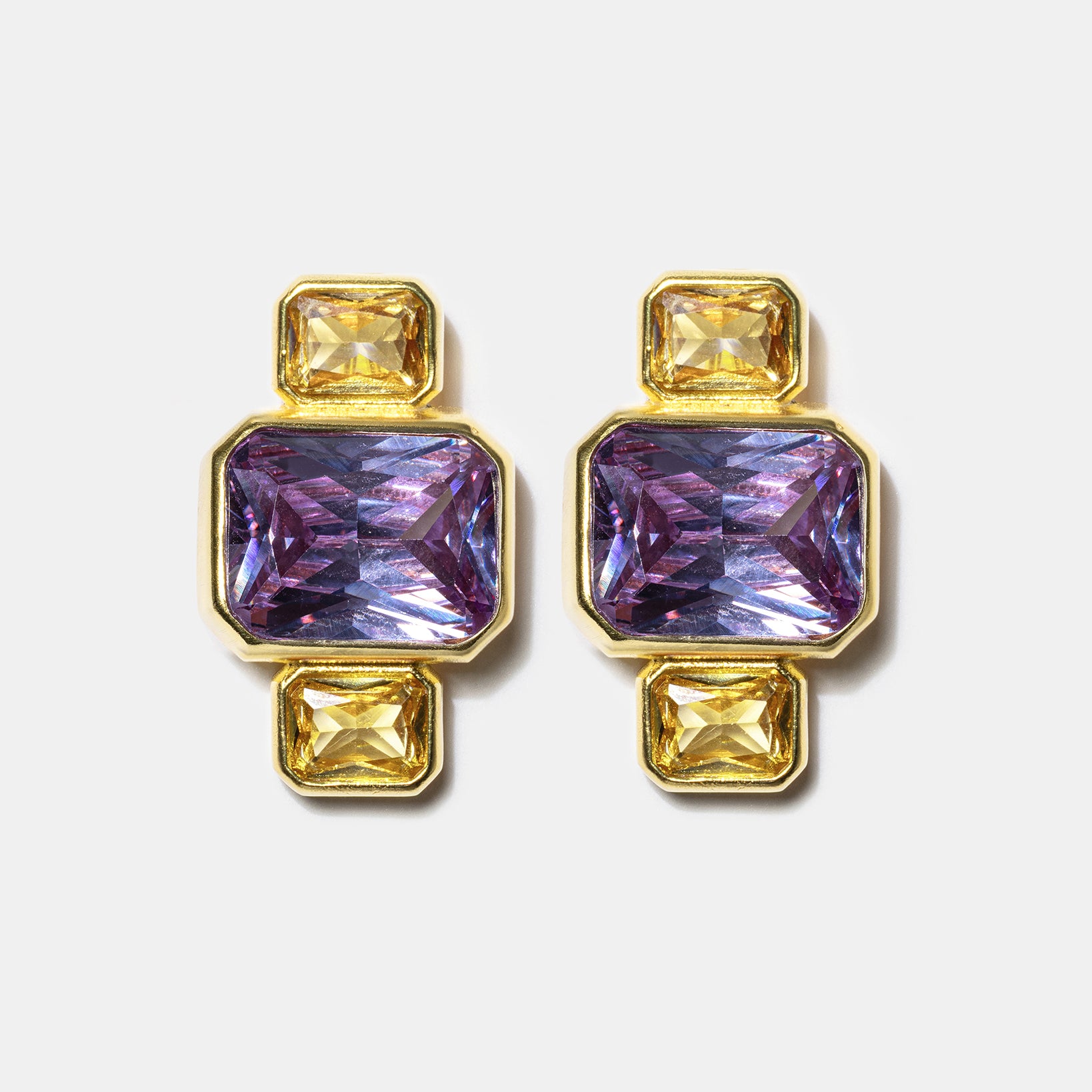 Gold geometric stud earrings with blue gemstones