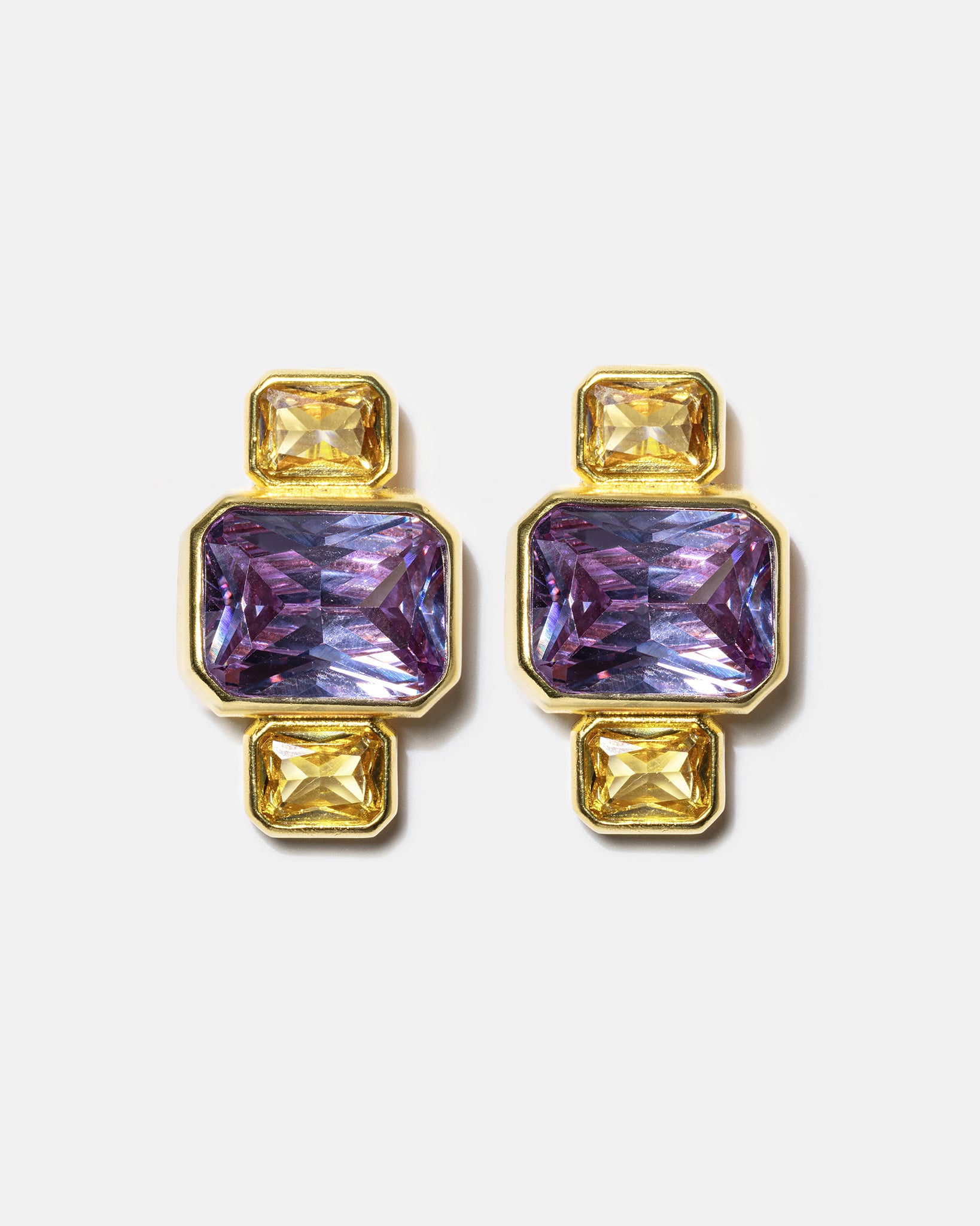 Gold geometric stud earrings with blue gemstones