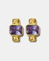 Gold geometric stud earrings with blue gemstones