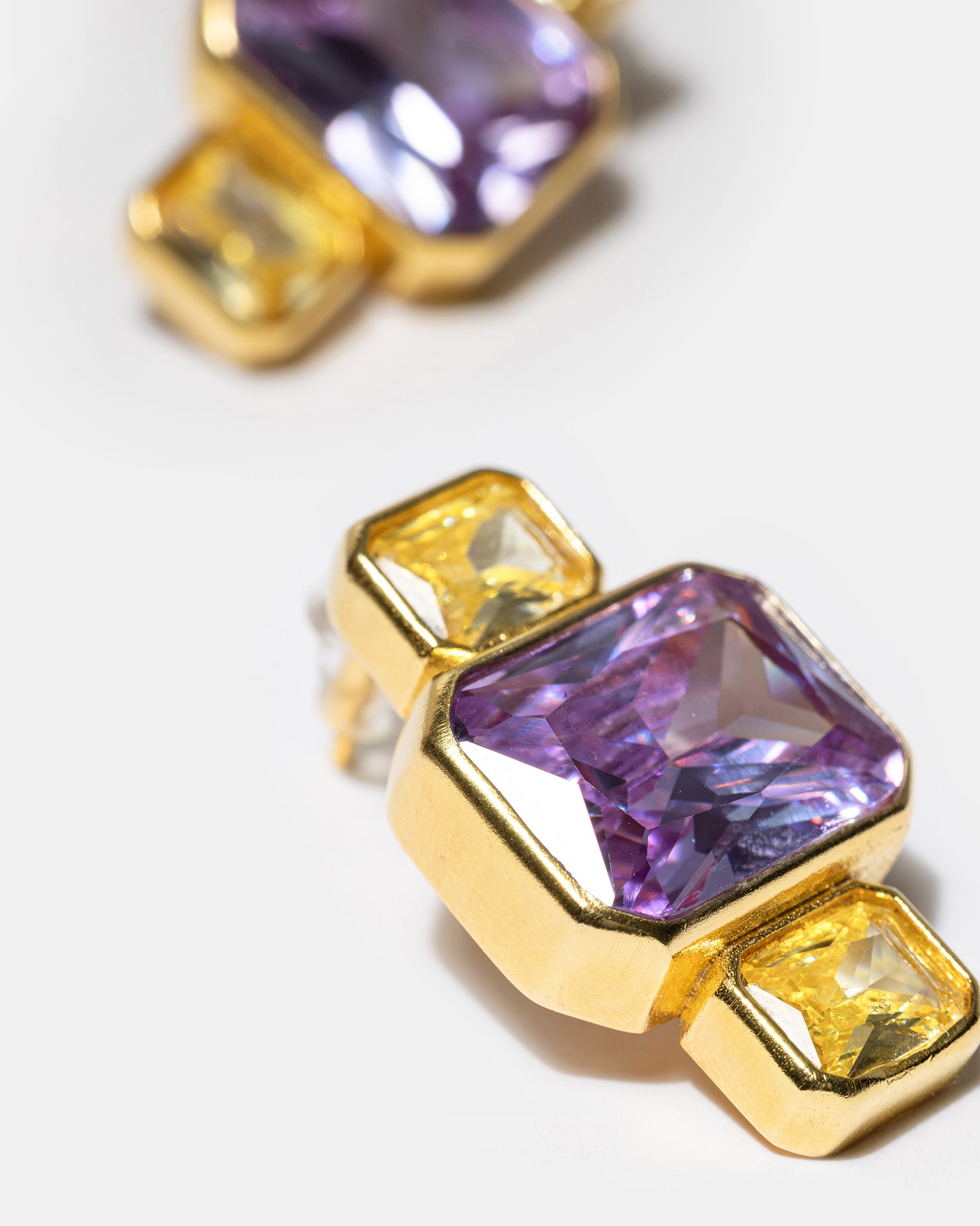 Gold geometric earrings with blue gemstones