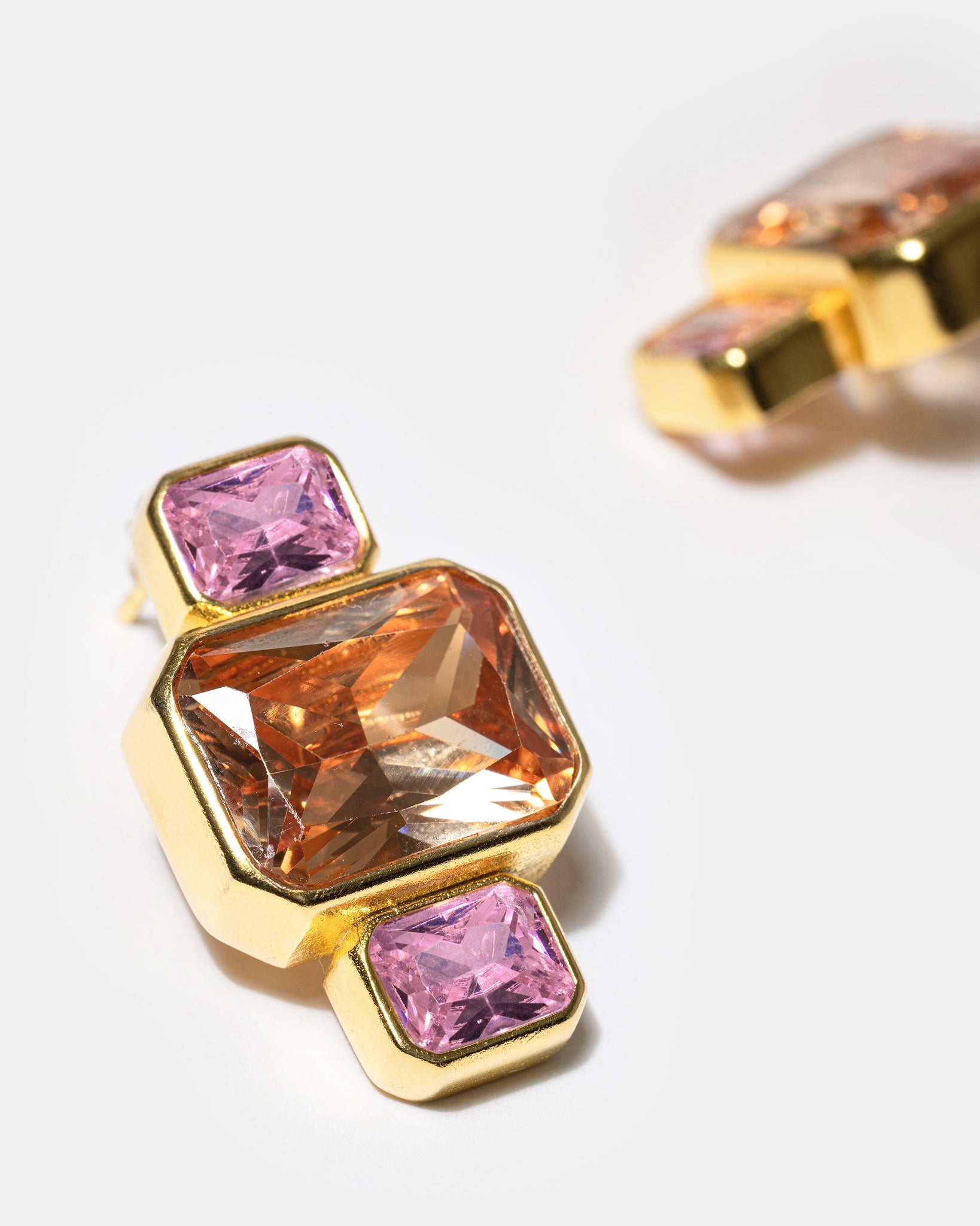 Gold geometric earrings with pink and amber gemstones