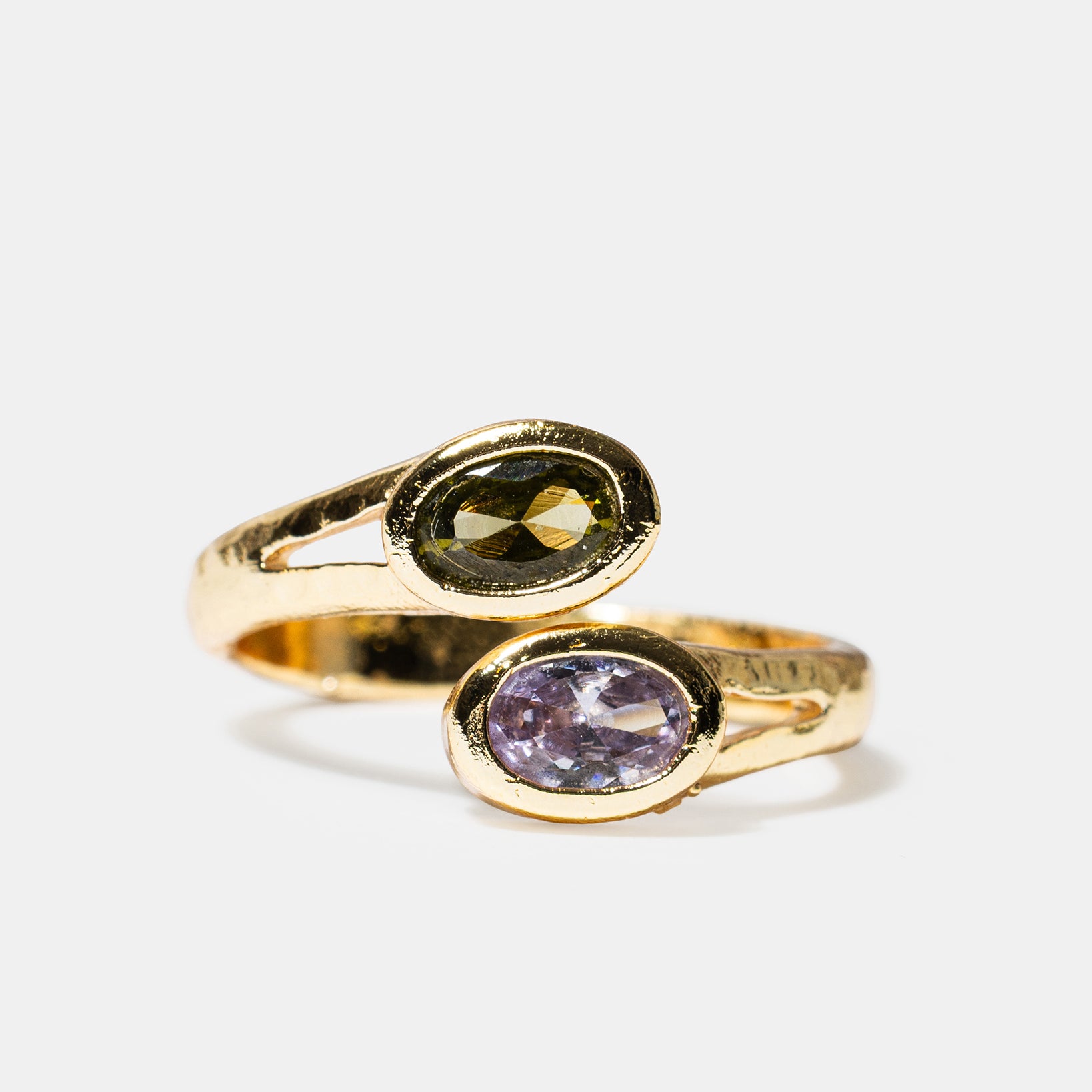Gold open ring with black and lavender oval gemstones