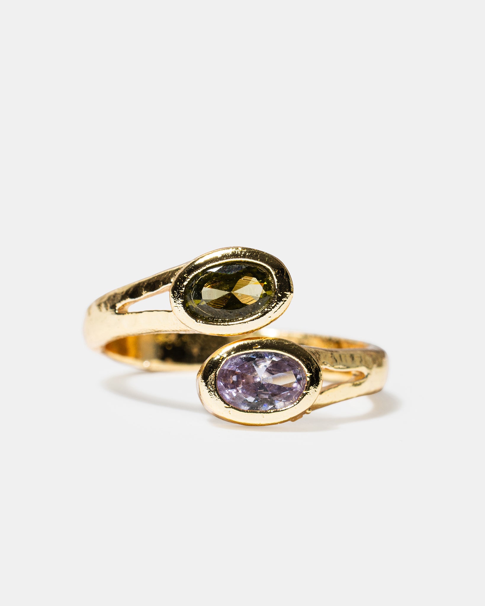 Gold open ring with black and lavender oval gemstones