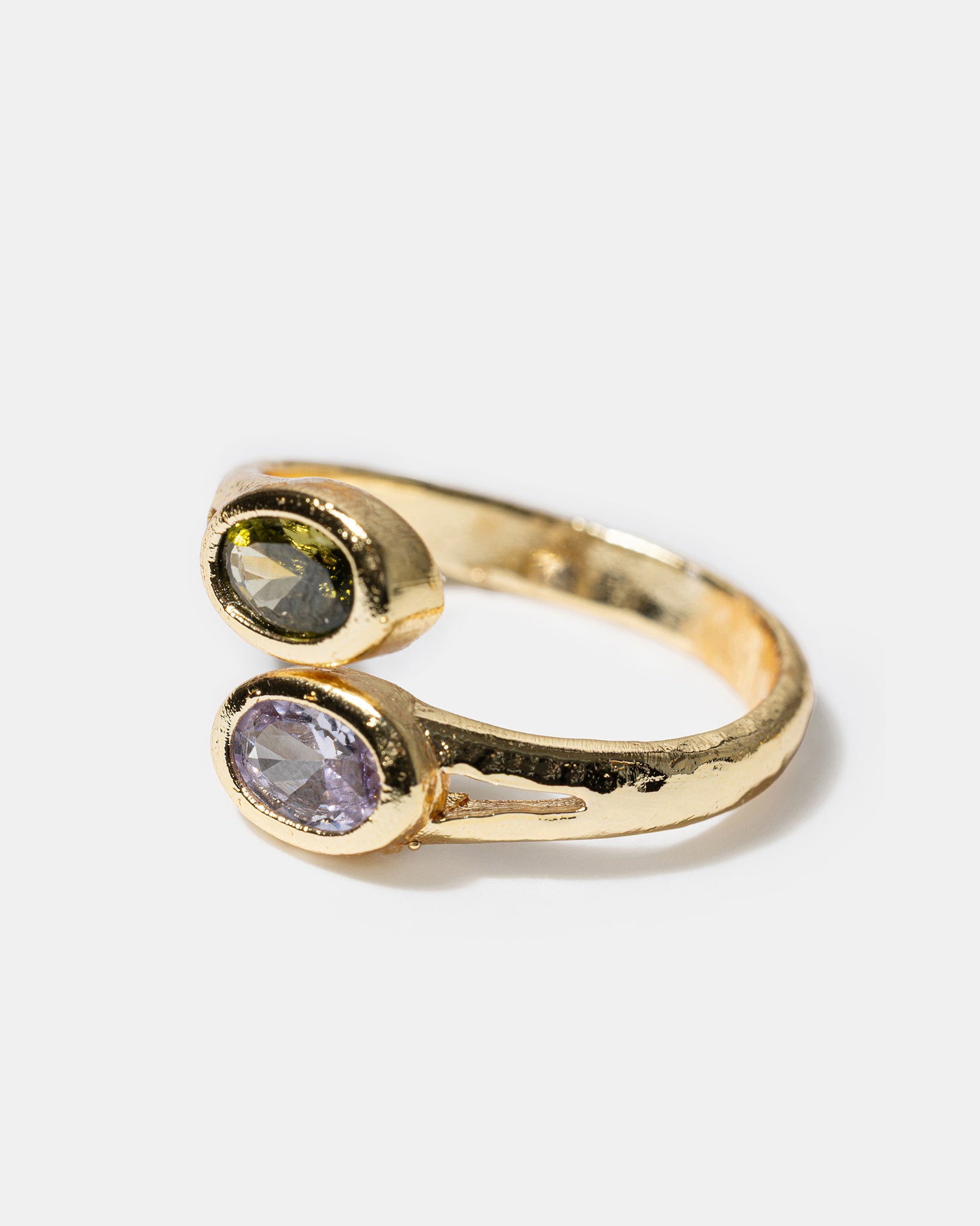 Side view of gold open ring with oval gemstones