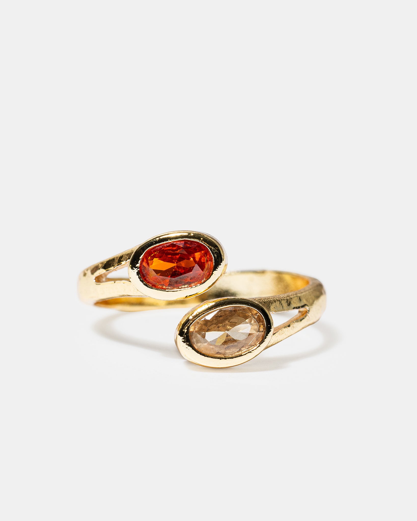Gold open ring with oval pink and champagne gemstones