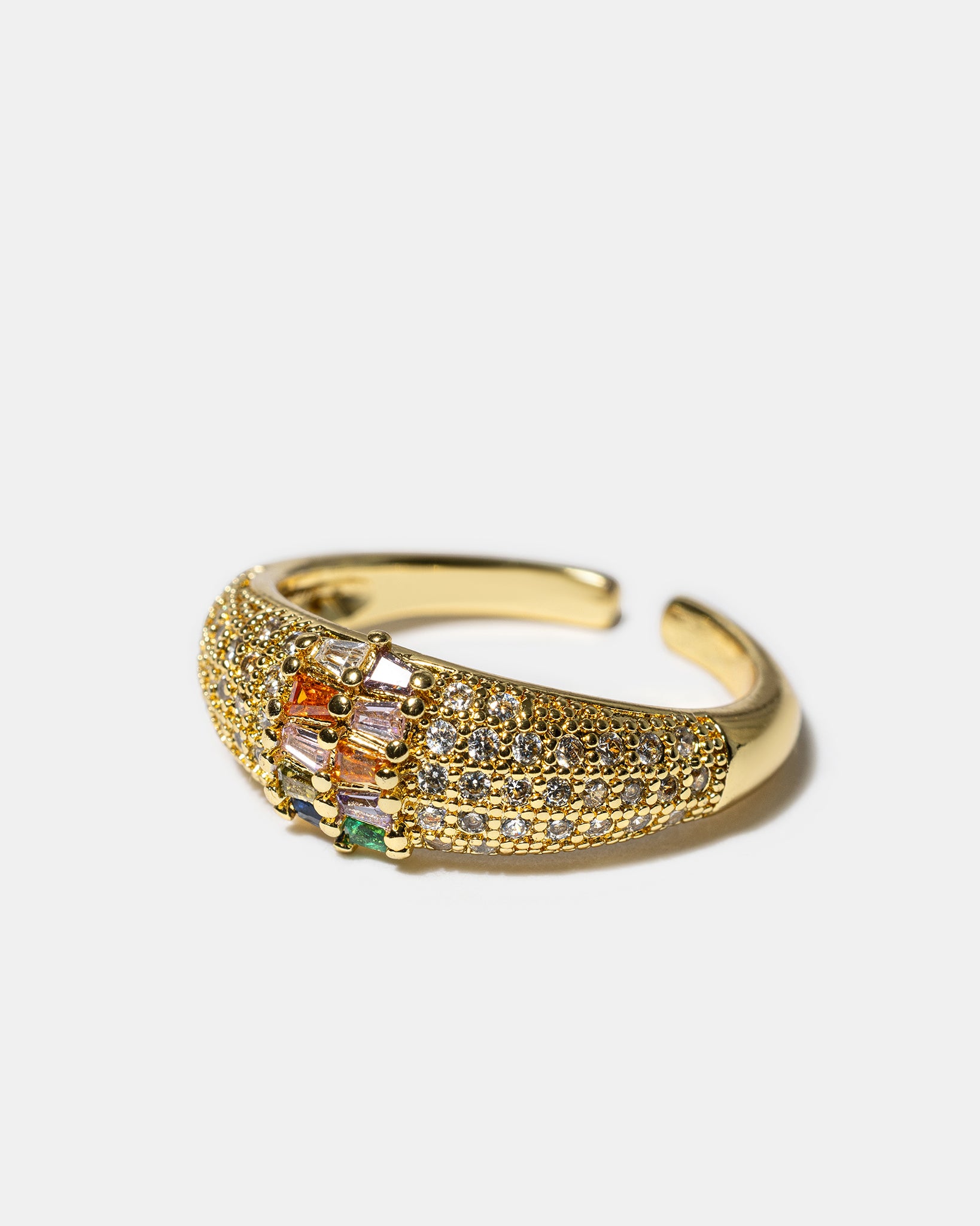 Side view of gold pavé stardust ring with multicolor gemstones