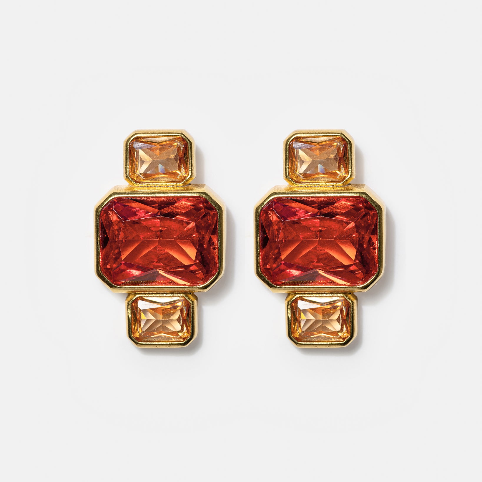 Gold geometric stud earrings with pink and amber gemstones