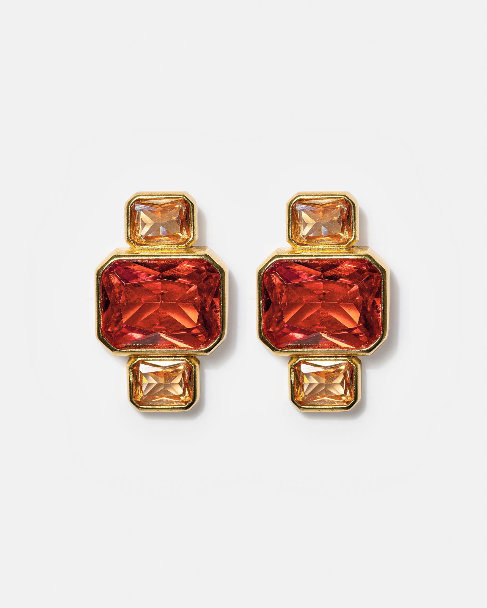 Gold geometric stud earrings with pink and amber gemstones