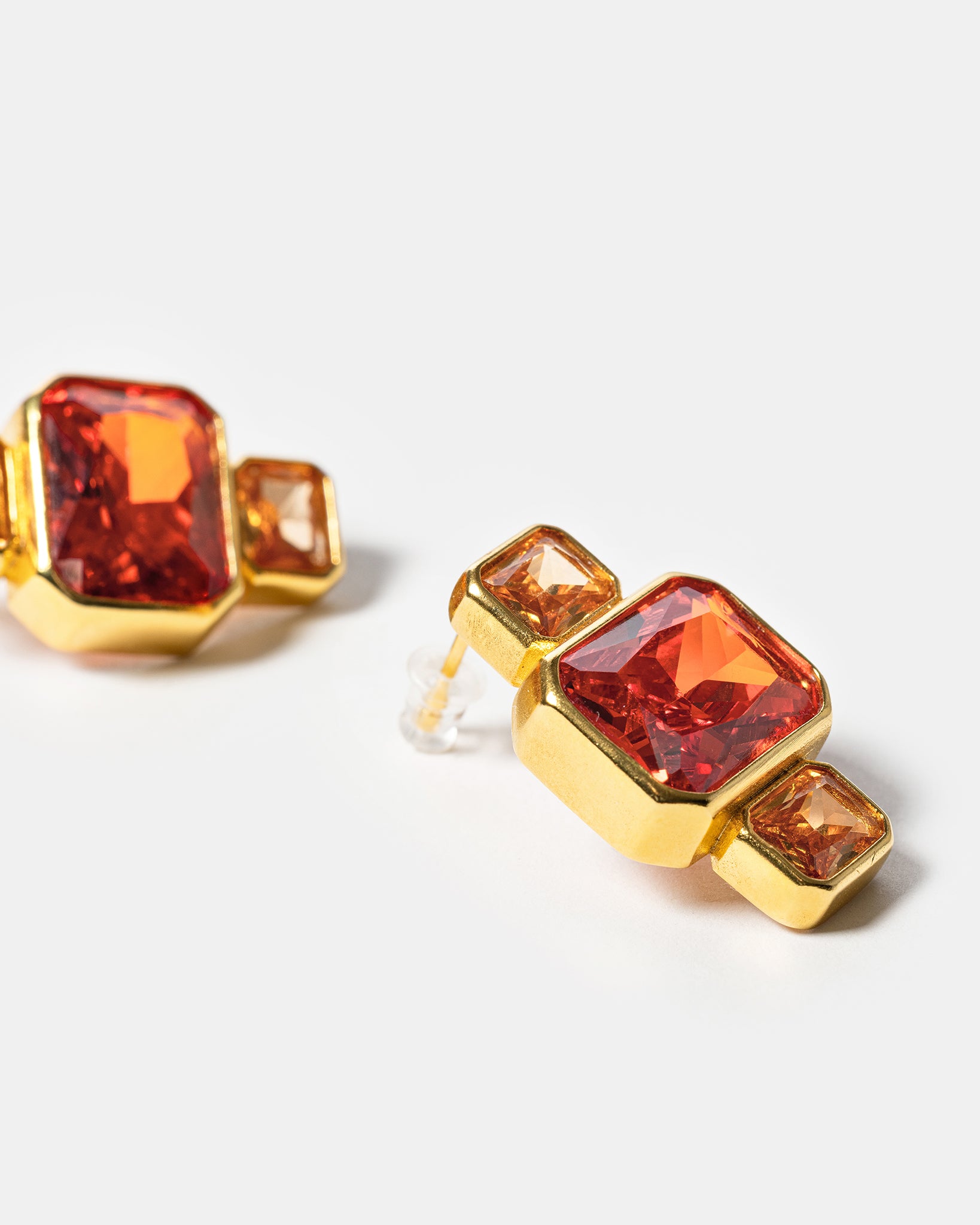 Gold geometric earrings with pink and amber gemstones