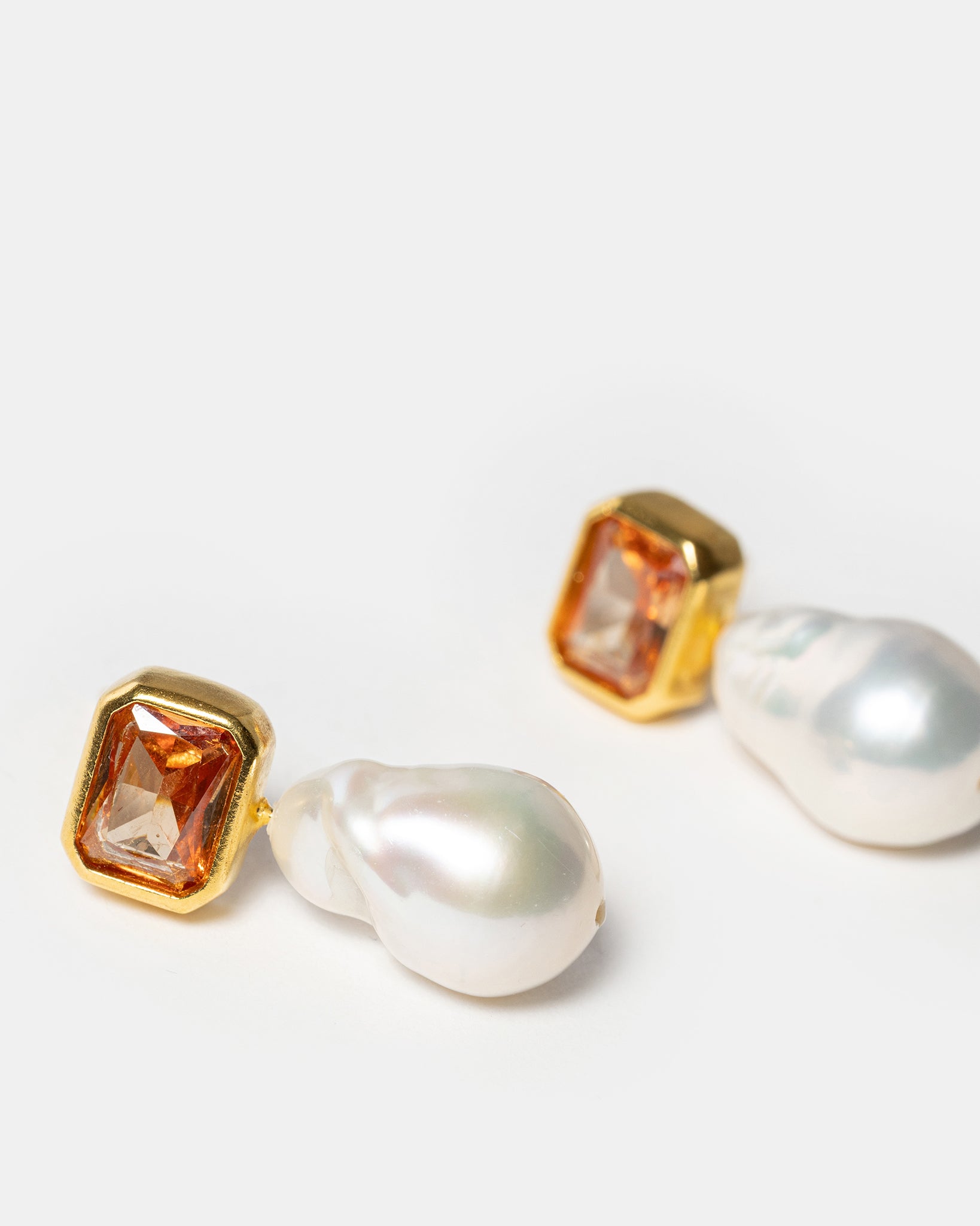 Gold drop earrings with baroque pearls and champagne gemstones
