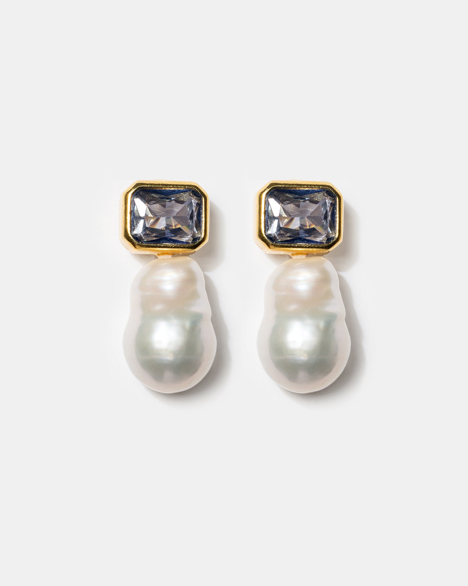 Gold pearl drop earrings with blue gemstones