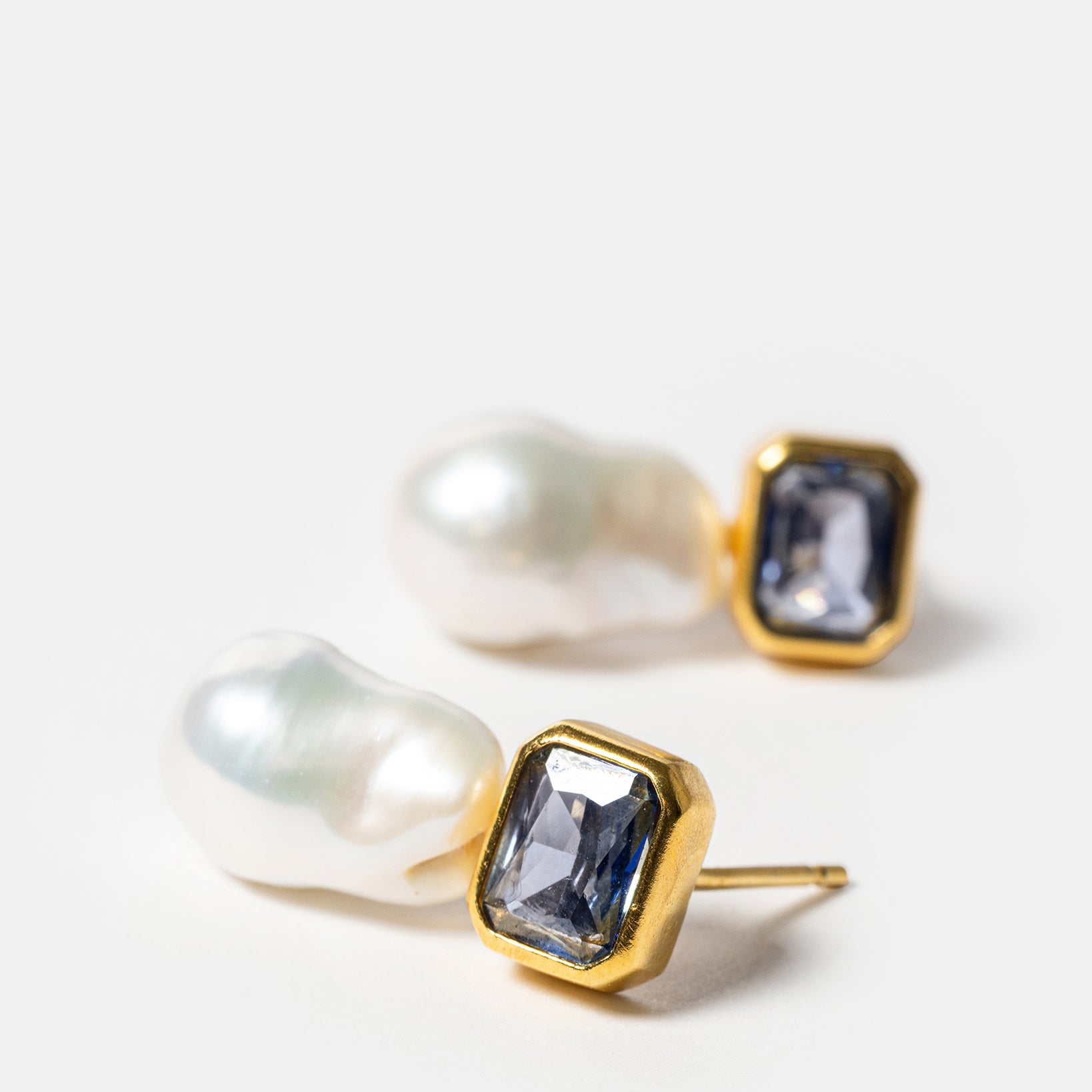 Gold drop earrings with baroque pearls and blue gemstones