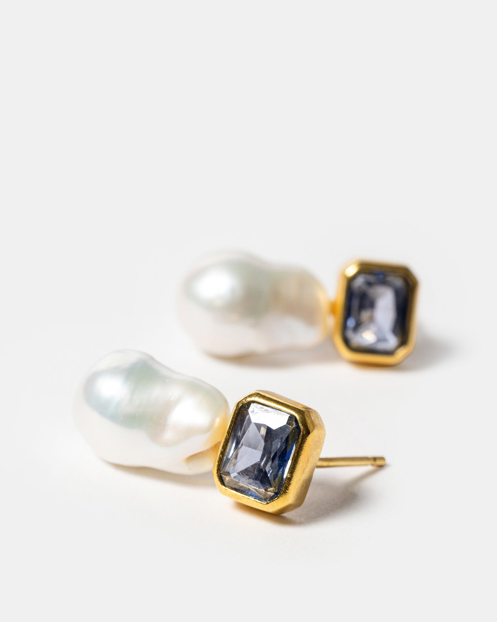 Gold drop earrings with baroque pearls and blue gemstones