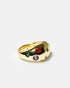 Side view of gold dome cocktail ring with multicolor gemstones