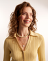 Woman styling elegant pearl necklace