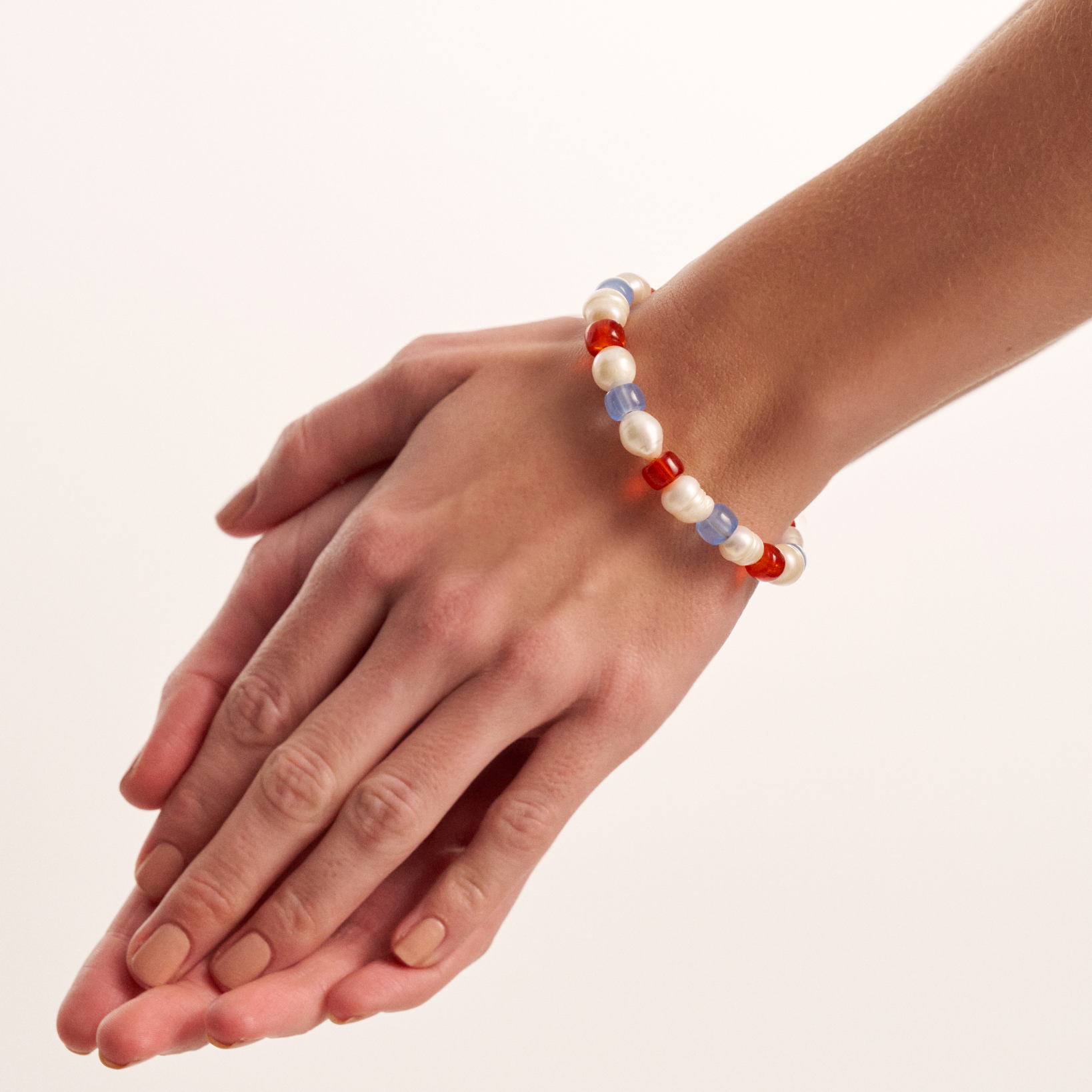 Close-up of colorful pearl bracelet on wrist