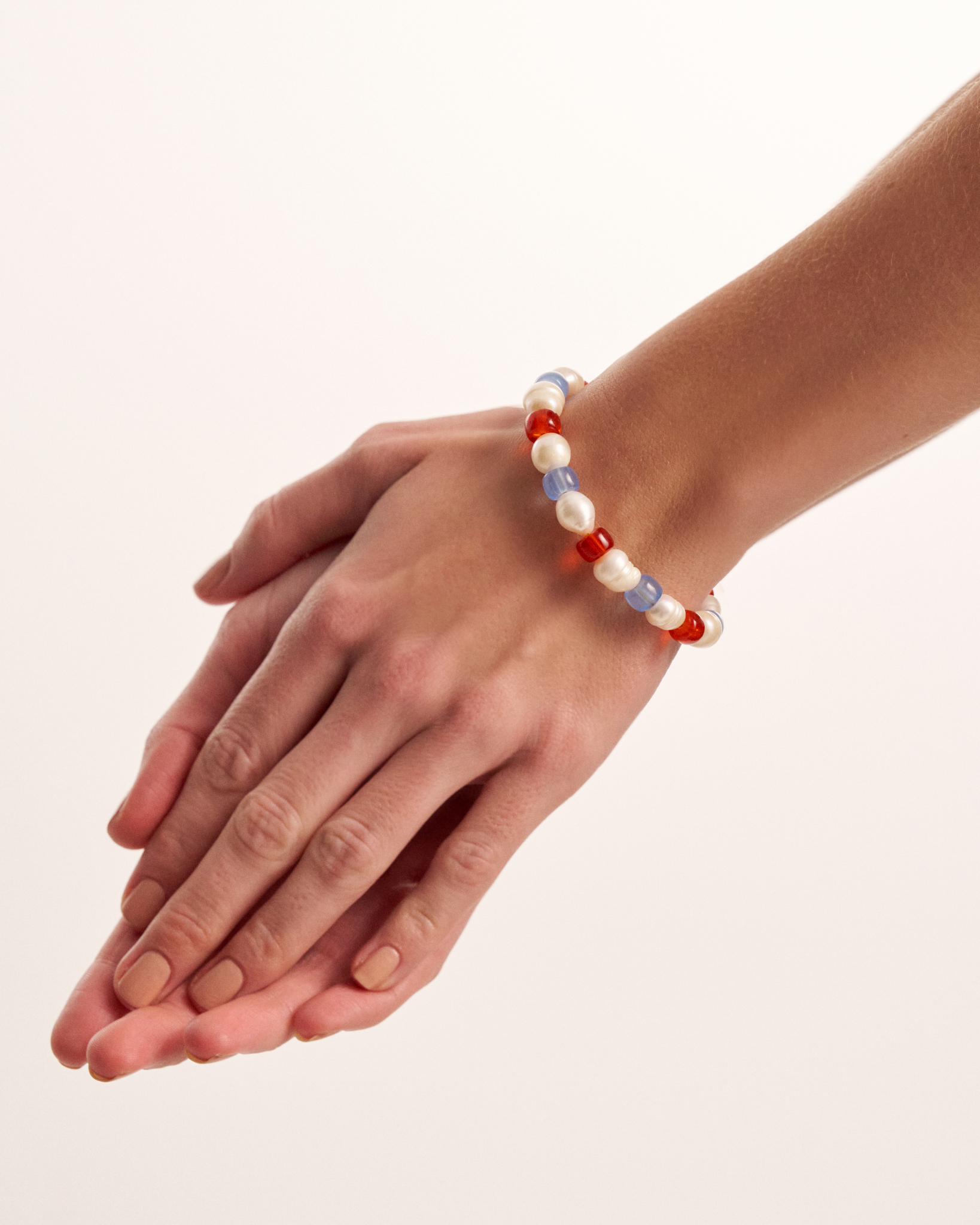 Close-up of colorful pearl bracelet on wrist