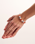 Close-up of colorful pearl bracelet on wrist