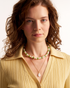 Layered minimalist pearl necklace look