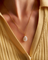 Woman wearing delicate pearl necklace