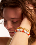 Woman wearing beaded pearl bracelet