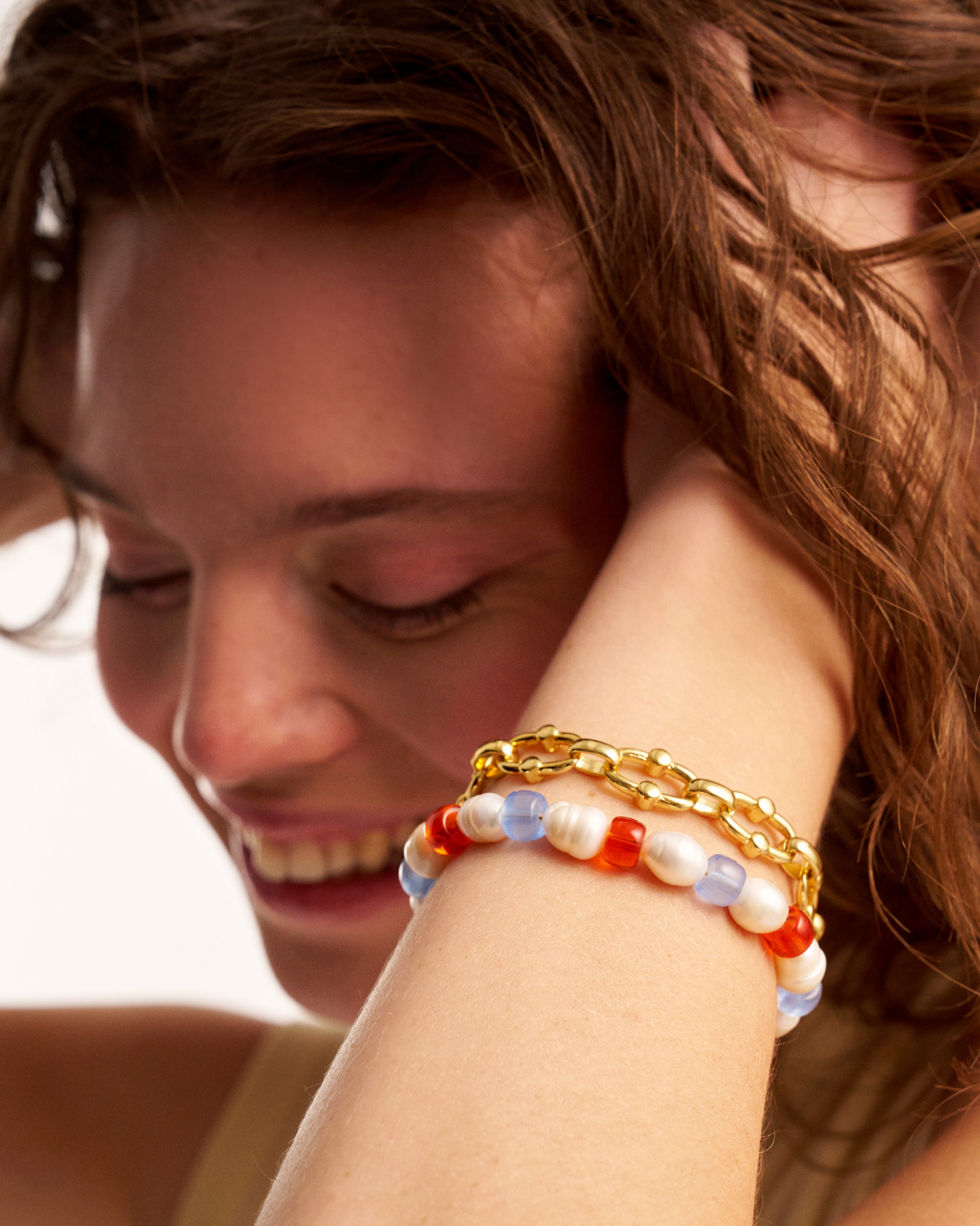 Woman wearing beaded pearl bracelet