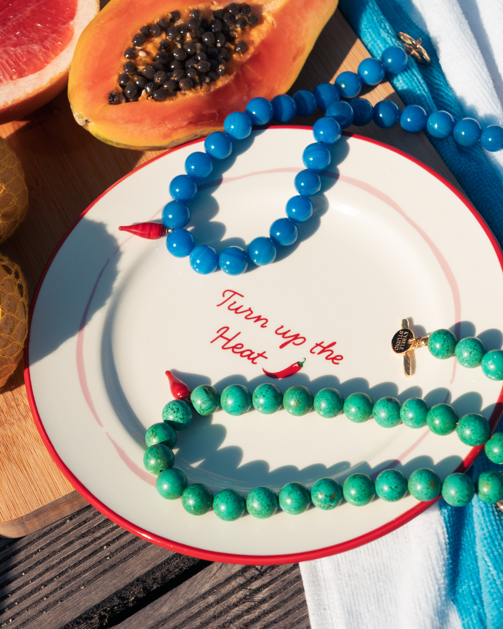 Turquoise and blue gemstone necklaces styled together for summer